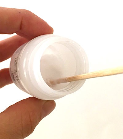 Dip and twist the glue-coated skewer in the chemical 