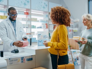 pharmacist answering questions helping customers