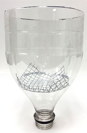 Wire mesh is inserted into the neck of a soda bottle that has been cut in half