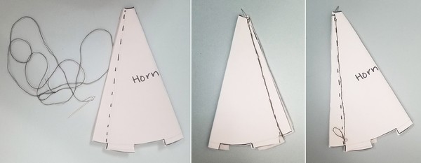 Needle threaded with normal thread for horn. The back of the horn that is stitched. The front of the horn that is stitched. 