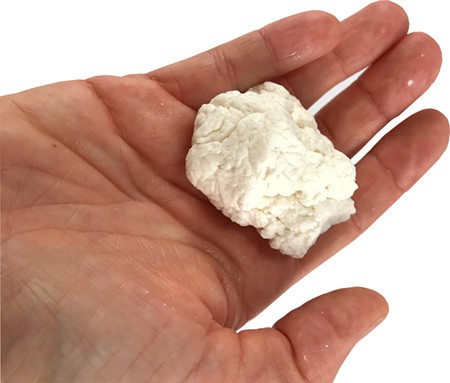 Curds are pressed together by hand and form a cohesive ball
