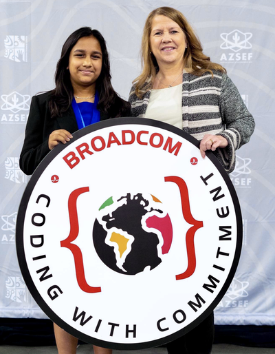 Suhana, 7th-grade student and winner of a Broadcom Coding with Commitment award, with a Broadcom Foundation representative at the 2023 Arizona Science and Engineering Fair (AzSEF)