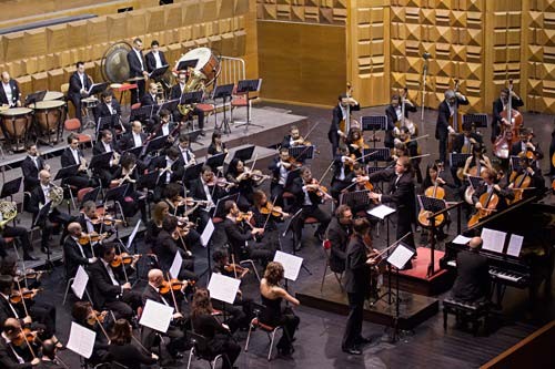 Photo of an orchestra performing on a stage
