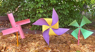 3 different pinwheels outside