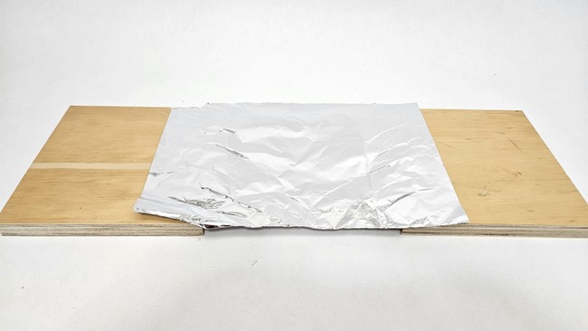 The first layer of an aluminum foil and plywood Whipple shield