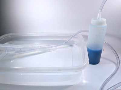 bottle connected to tubing in gas collection apparatus