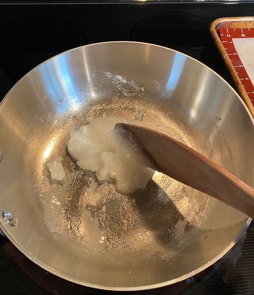 stirring ingredients in saucepan