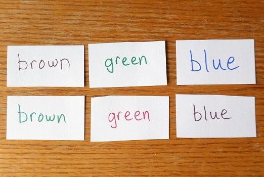 The words 'Blue,' 'Green,' and 'Brown' each written each written twice on individual index cards, with one of each pair written in a non-matching color.