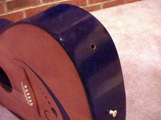 A hole at the base of a guitar