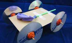 A banner encouraging students to try building the balloon-powered car as part of the 2015 Engineering Challenge.