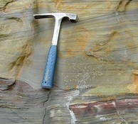  sedimentary rock with visible horizontal layers 