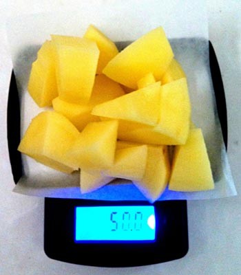 50 grams of small chunks of potato are weighed on a scale