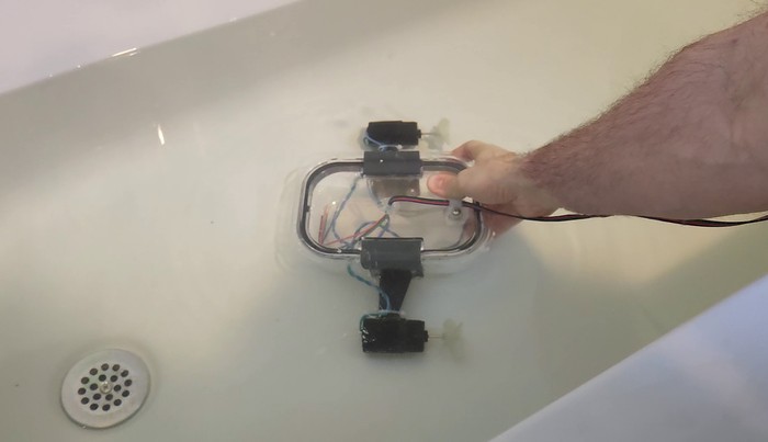 The ROV with electronics removed submerged in a bathtub