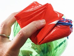 A second picture shows the parachute folded so it fits neatly on top of the bottle rocket.