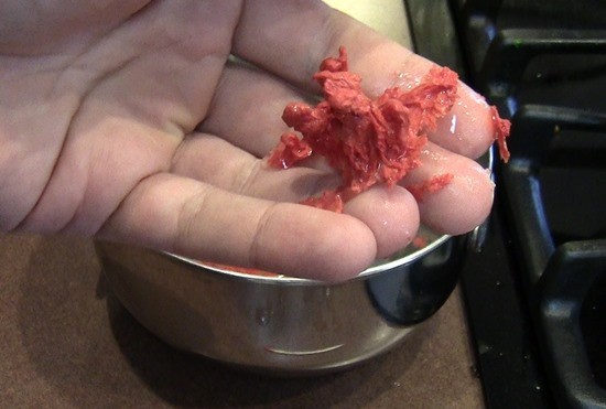 A twisted blob of solidified wax representing an igneous rock.