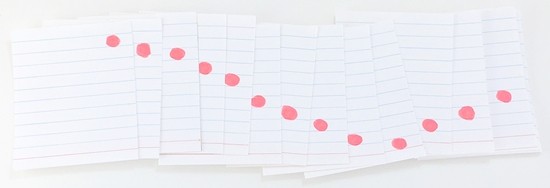 Stack of partially overlapping cards. One red dot is visible in each card. The dots are gradually drawn lower until it is near the bottom of the card, then, it is gradually rising again. 