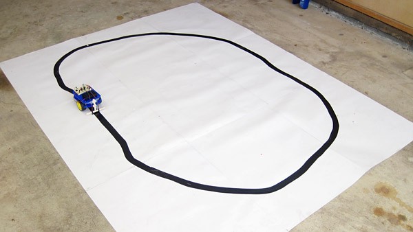 A line tracking robot following a black path on a white sheet of paper