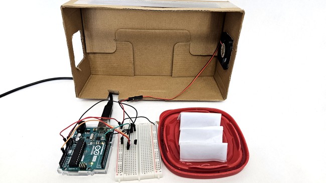 Box tilted up to show components inside