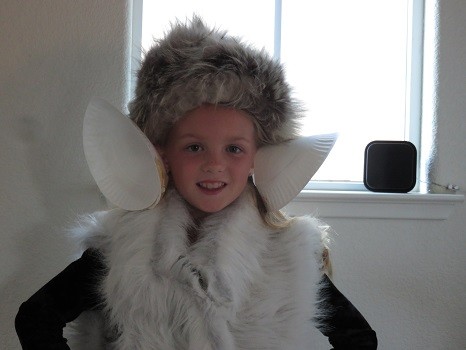 Child wearing large ears made from paper plates