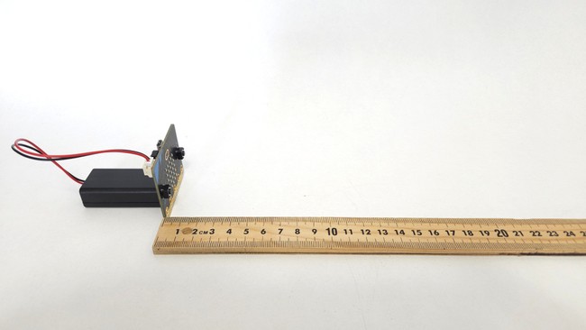 receiver micro:bit set up next to meter stick