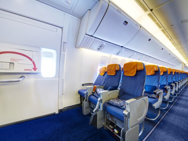 airplane interior near the exit door