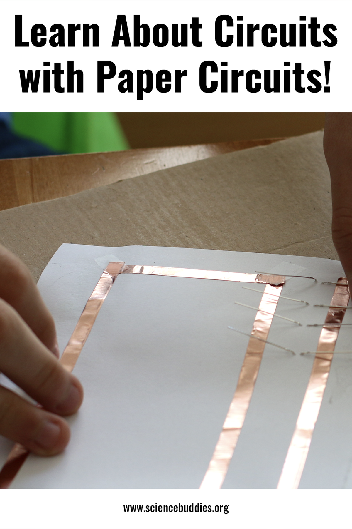 Student making a paper circuit with copper tape - part of Paper Circuits Science Collection at Science Buddies