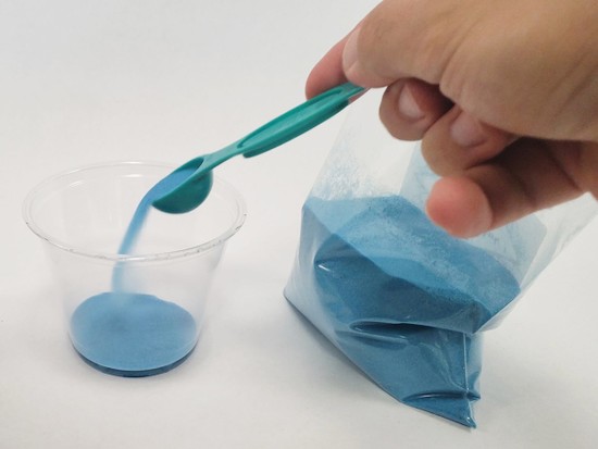 Layer of sand in the bottom of a plastic cup