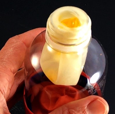Lung model while a piece of gelatin almost completely blocking the entrance to the balloon.