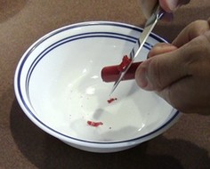 Shaving crayon pieces with a knife