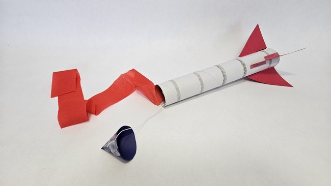 cardboard rocket with ribbon streamer