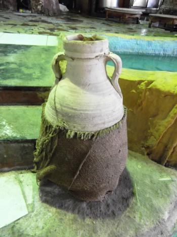 A clay jar wrapped on a coarse cloth
