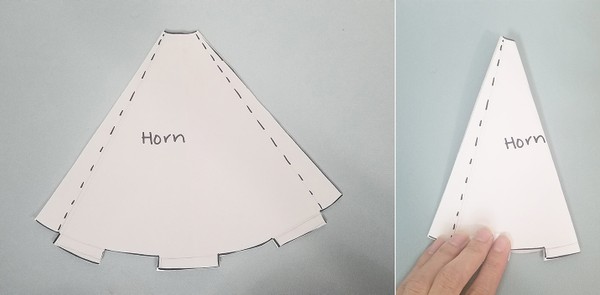 Horn paper template on felt. Horn paper template folded in half.