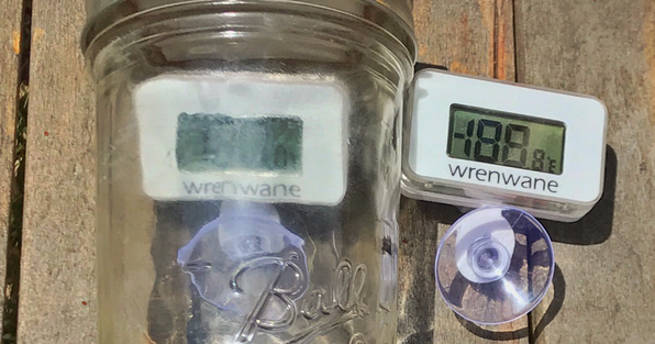 Jar with thermometer next to thermometer outside jar
