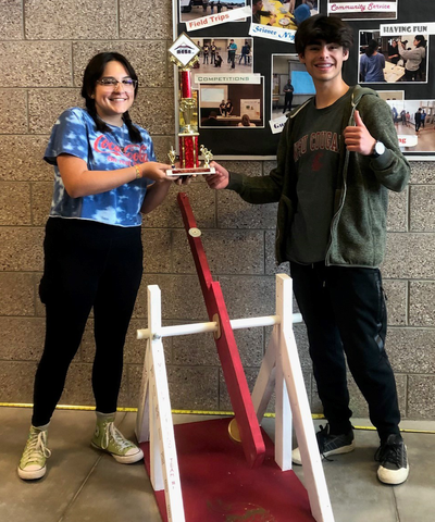 Students with trebuchet from MESA Day