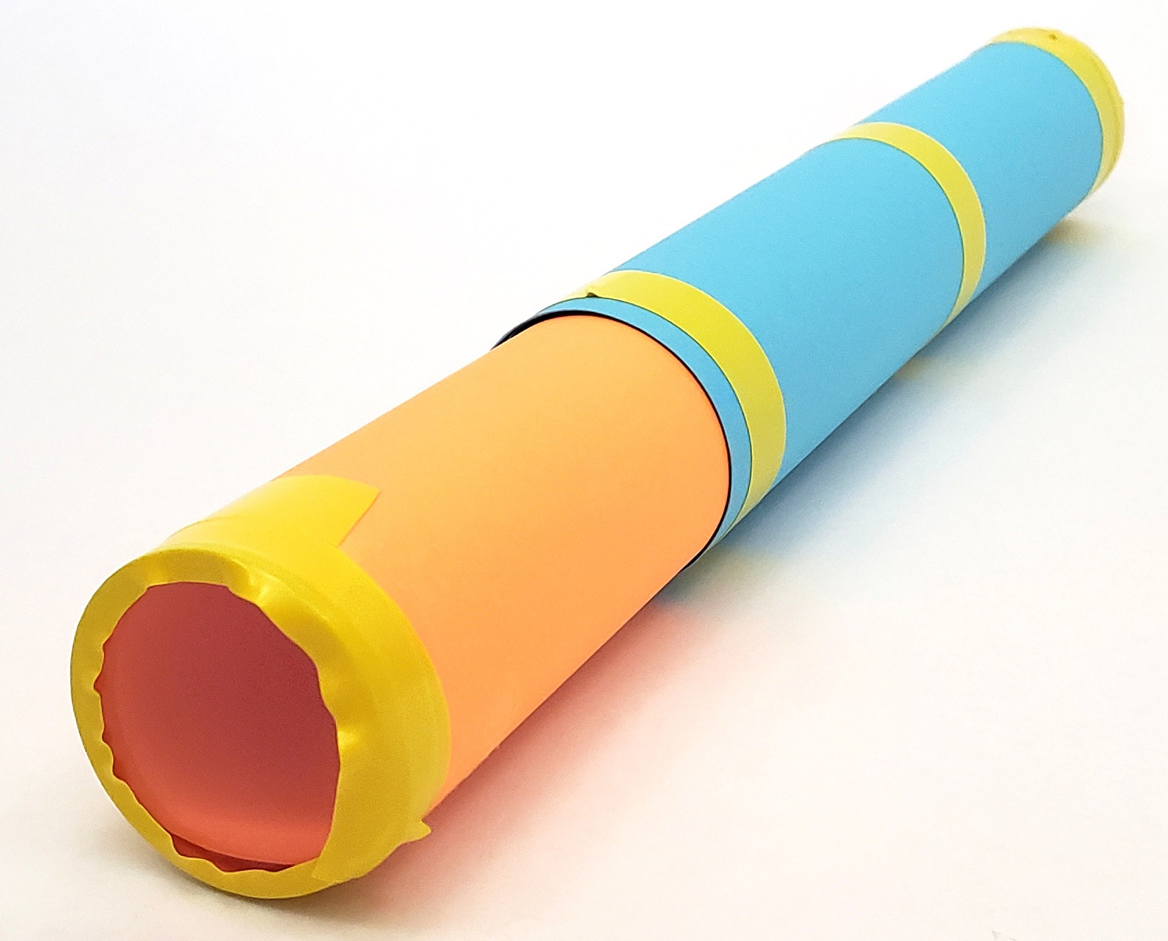 Concave lens taped to the other end of the cardstock tube.