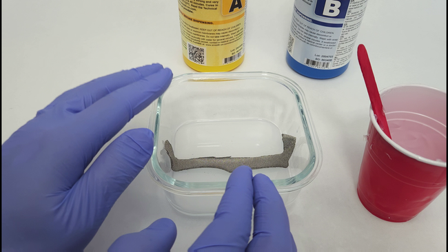 layer of conductive fabric on top of layer of silicone