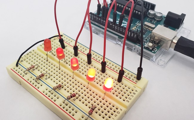 an arduino connected to five LEDs on a breadboard at different brightness levels