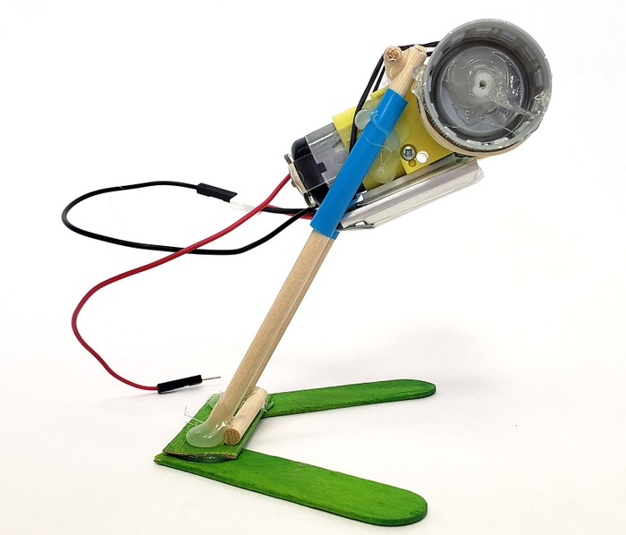The side of the robot. A small lithium battery is taped to the underside of the motor.