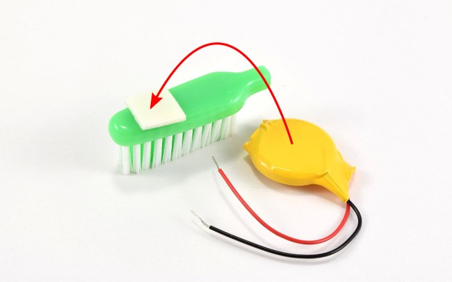 Attach battery to foam tape.