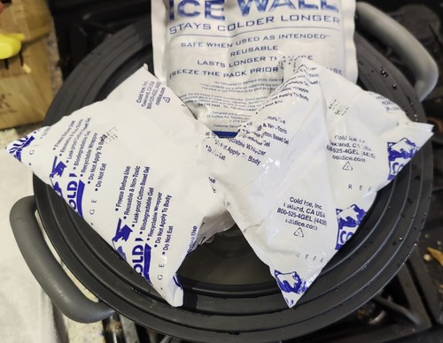 Distillation setup in pot with ice packs on top