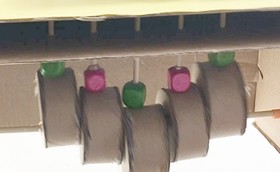An illustration of the driving mechanism of the caterpillar automaton. The first picture is a snapshot of a moment where the driving cylinders form a V shape.